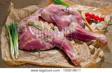 Raw Lamb Shanks On A Wooden Board