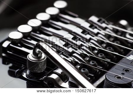 Electric guitar parts tremolo and tuners close-up