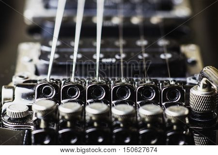 Electric guitar parts tremolo and tuners close-up