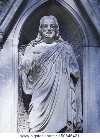 Jesus Christ the teacher (statue on dlue background)
