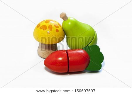 Wooden kids fruit and vegetable toys. Isolated on white background.