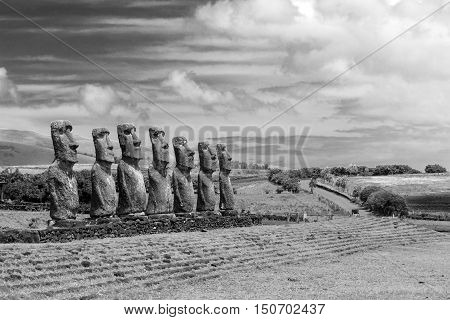 Black and white photo of moai statues at Ahu Akivi on Easter Island in Chile