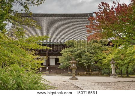 Kyoto Japan - September 15 2016: The main shrine of the Shinnyo-do Buddhist Temple dominates the temple grounds and sits among colorful trees.