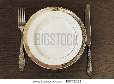 Античный вилка, нож и плиты