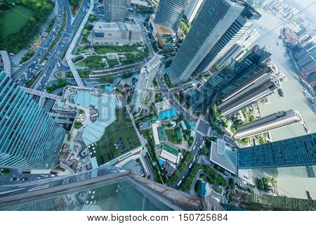 SHANGHAI - AUG 13, 2015: Above view of skyscrapers and river quay, view from IFC hotel, 990 skyscrapers are in Shanghai
