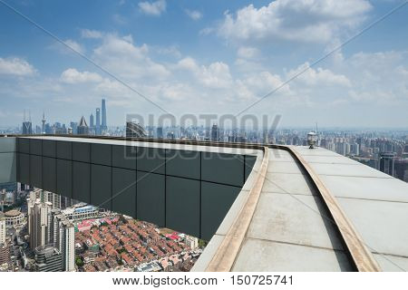 SHANGHAI - AUG 13, 2015: Roof of Plaza 66 building, Tower One is 288 metres (945 ft) high and was completed in 2001, while Tower 2 is 228 metres (748 ft) high and was completed in 2006