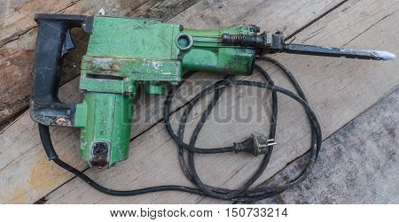 Electric hammer Plugger. on the old wood