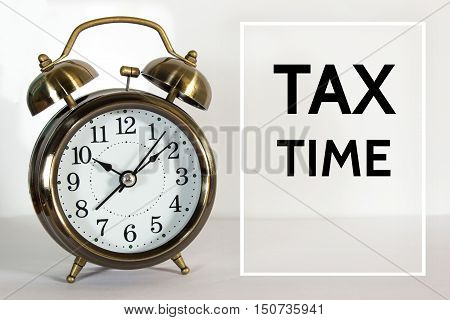 Text Tax time on clock background / time concept