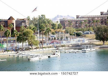 The shores of Lake Havasu with a boardwalk city views and jetties in Lake Havasu City.
