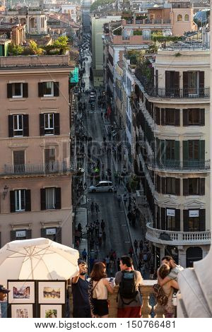 ROME ITALY - JUNE 11 2015: Spanish Steps and Via Condotti in Rome. This street is the center of fashion shopping in Rome with the atelier of Bulgari Armani Cartier Fendi Gucci and others.