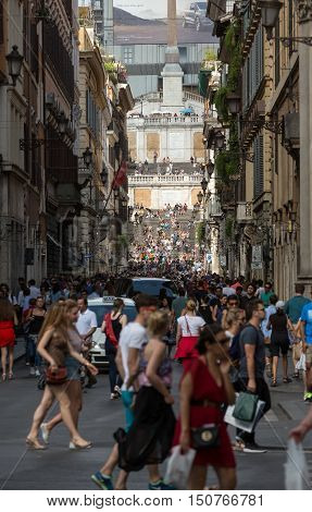 ROME ITALY - JUNE 15 2015: Spanish Steps and Via Condotti in Rome. This street is the center of fashion shopping in Rome with the atelier of Bulgari Armani Cartier Fendi Gucci and others.