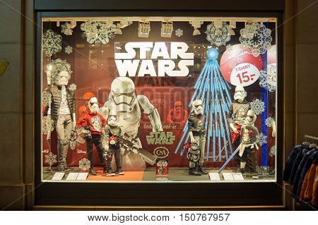 GENEVA, SWITZERLAND - NOVEMBER 18, 2015: a shop window at night. A shop window is a window in a shop displaying items for sale or otherwise designed to attract customers to the store.