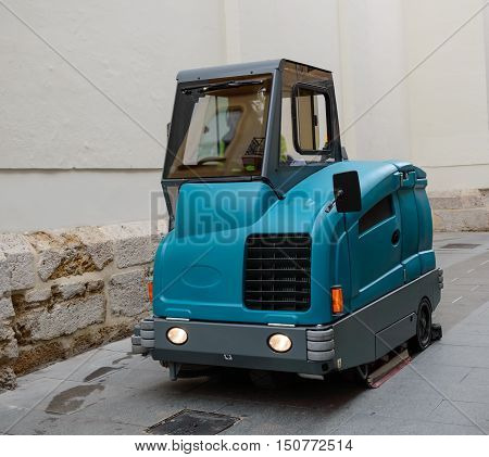 Street cleaning machine in the process of street washing