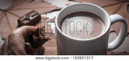 Mug of coffee with chocolate. Selective focus