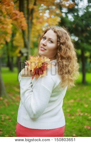 beautiful young plussize model in the autumn park