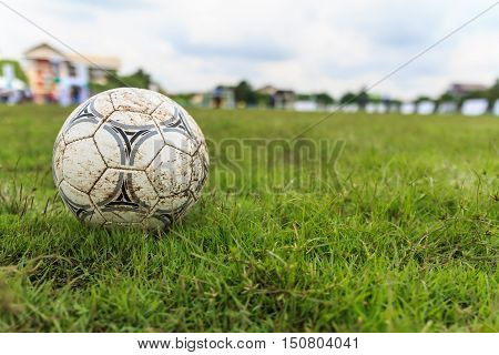 Nakhon Ratchasima Thailand - October 1 : Muddy soccer ball on a football field in Municipal Stadium Nakhon Ratchasima on October