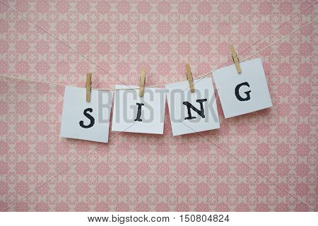 White Sheets Of Paper On A Pink Background, White Sheets On Clothespins