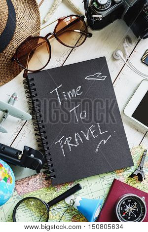 Overhead view of Traveler's accessories and items with black notebook and copyspace Travel concept