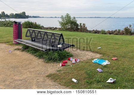 Uncollected rubbish at picnic place near Dutch lake