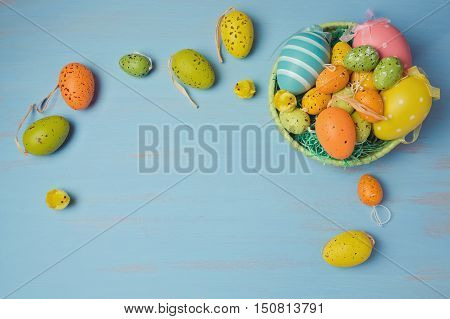 Easter holiday background with egg decorations. View from above