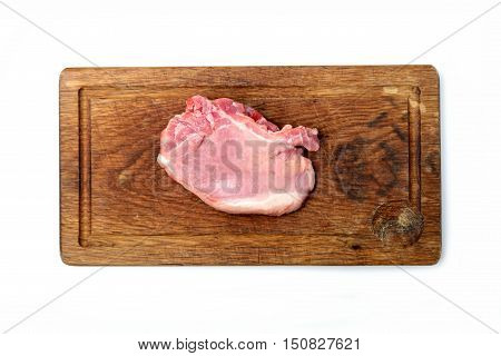 raw pork steak on a cutting board with the original structure on a white background