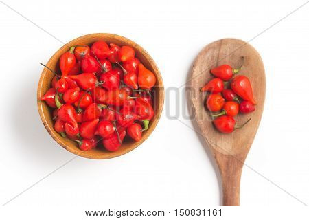 Biquinho Pepper into a bowl. Capsicum Chinense isolated in white background