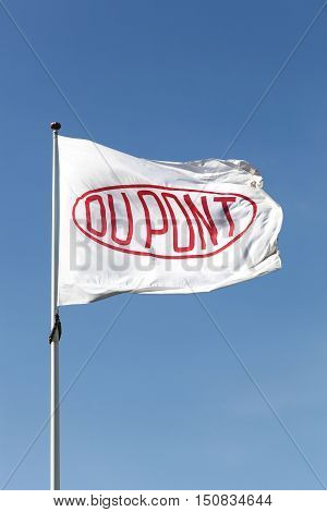 Aarhus, Denmark - May 16, 2016: Flag of the brand Du Pont. DuPont is one of America's most innovative companies and it is an American chemical company that was founded in July 1802 as a gunpowder mill