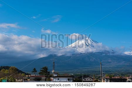 Fuji Mountain view from Japanese countryside town and blue sky background.