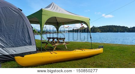 Kayak And Tent In Sandspit Beach New Zealand