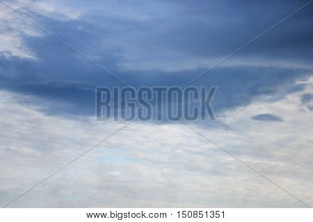 blue sky and formation raincloud dark motion have shape beautiful colourful in evening nature for background