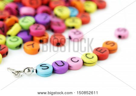 Success Text  combining of Colorful Letter Beads