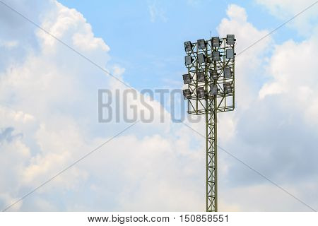 Sport stadium floodlights on a cloudy background. Soccer stadium lighting.