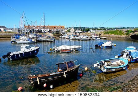 AXMOUTH, UNITED KINGDOM - JULY 18, 2016 - Yachts and fishing boats moored in the harbour Axmouth Devon England UK Western Europe, July 18, 2016.