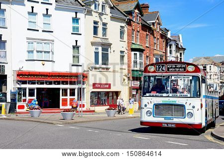 SEATON, UNITED KINGDOM - JULY 18, 2016 -Bristol RE tour bus along a town centre shopping street Seaton Devon England UK Western Europe, July 18, 2016.