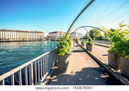Geneva, Switzerland - June 23, 2016: Bergues pedestrian bridge in the center of Geneva city. Geneva is a financial center and worldwide center for diplomacy in Europe