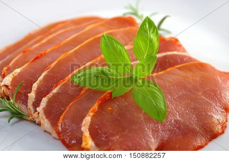 raw pork chops on a white plate
