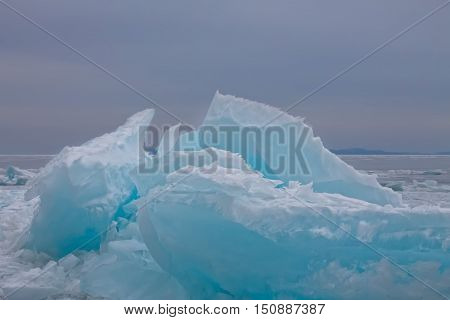 Clumps Of Blue Ice Hummocks Lake At Dusk