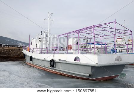 Ship And Fisher Boats On The Dock In Large Goloustnoye Village. Baikal Lake