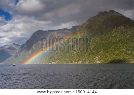 Beautiful rainbow at the Hjorundfjord, Fjordland, Norway