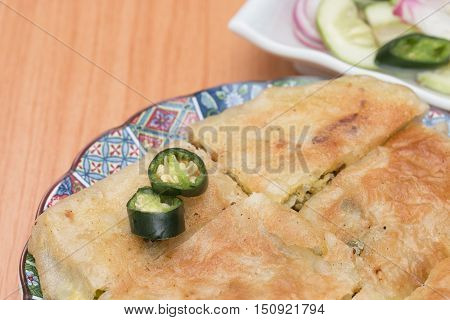 Martabak or murtabak is a stuffed pancake is arab food.