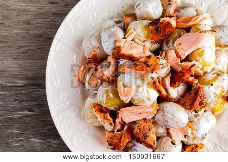 Salmon and young potato warm salad with a lemony yogurt dressing.