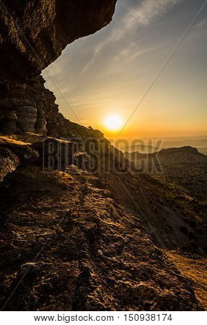 Sunset on the edge of a cliff in the Torcal de Antequera, Málaga, Spain