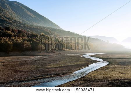 Lake Barrea after the summer season remains without water if not with a small river Abruzzo National Park, Italy