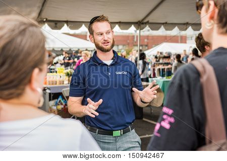 Washington DC, USA - September 24, 2016: SolarCity salesman representative at VegFest festival