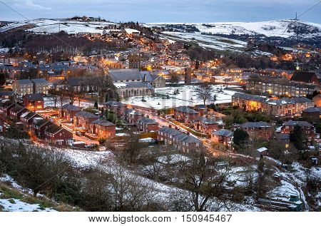 Ancient stone villages are folded into creases in the Peak district England.