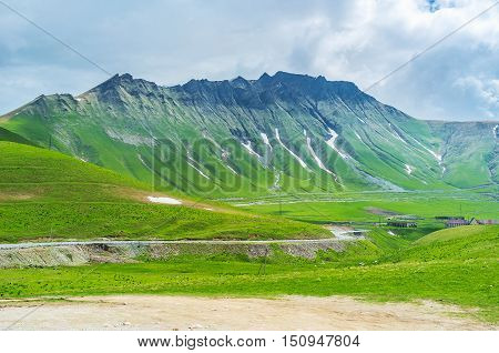 The tiny snowfields on the of the sharp mountain on Cross Pass Gudauri Georgia.