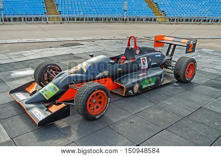 Dnepropetrovsk Ukraine - October 06 2013: Exhibition of cars and motorcycle and other vintage technics. The automobile which will participate in the for demonstration races