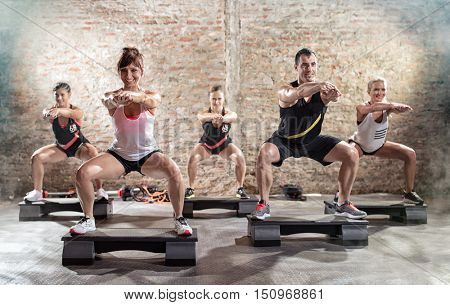 Group of people having  step training