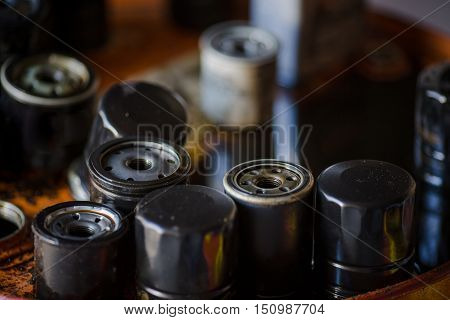 Closeup picture of automobile or car oil filters in automobile servece center. Closeup picture of old oil filters for automobile.