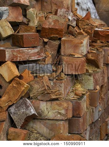 Crumbled red brick wall background. Brick old house wall.